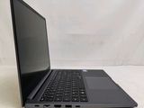 an open laptop computer sitting on top of a white surface