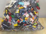 a bag full of legos sitting on a table
