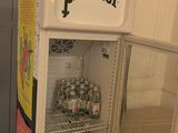 a refrigerator that has a lot of bottles inside of it