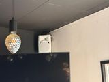 a flat screen tv mounted on the wall in a room