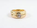 a close up of a gold ring with a diamond in the middle
