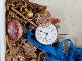 a box with a bunch of jewelry inside of it
