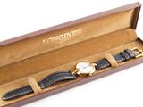 an image of a watch in a box on a white surface