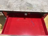 a red box that has some screws in it