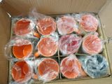 a box full of oranges that are wrapped in plastic