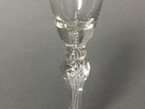 a wine glass that is sitting on a table
