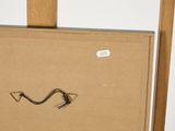 a picture of a picture on a easel with a piece of paper attached to it