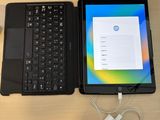 two laptops that are sitting on a table next to each other