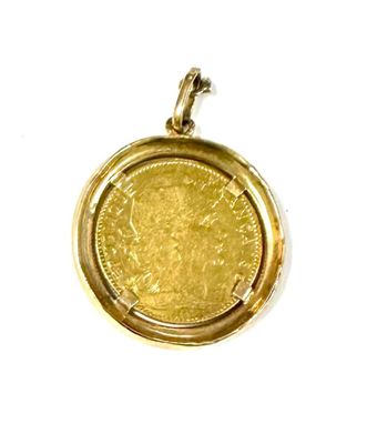 an image of a gold coin in a pendant on a white background