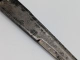a knife that is laying on top of a table