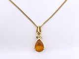a yellow necklace with a tear shaped pendant on a gold chain