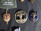 a lot of badges that are on a black table