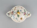 a small bowl with a flower design on it