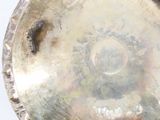 a silver plate that is sitting on top of a table