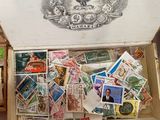 a box full of stamps sitting on top of a table