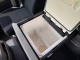 a cooler in the back of a car that is open