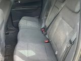 the back seats of a car are empty in a parking lot