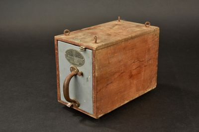 a small wooden box with a handle on it