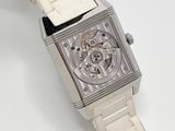 a watch that is sitting on a white table