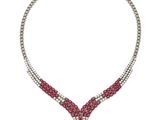 un collier en diamants et rubis, signé Cartier