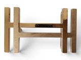 a wooden bench that is made of wood and has a metal handle