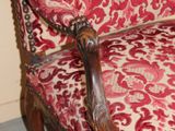 a red and white chair with a red and white pattern on it