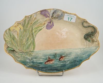 a plate with a painting of a fish and flowers on it