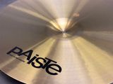 the paiste cyb is sitting on top of a black table