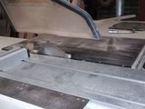 an image of a machine that is working on a piece of metal