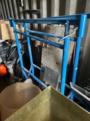 a blue cart with a bunch of items inside of it
