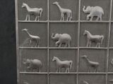 an image of a display of animal figurines in a cage