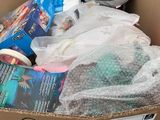 a cardboard box filled with items that are on the floor