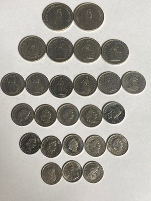 a lot of coins that are arranged in the shape of a christmas tree