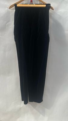 a black pants hanging on a hanger on a white background
