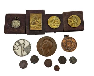 an image of a collection of coins and other items on a white surface