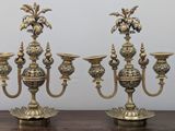 three candles that are sitting on a table