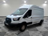 the white van is parked on a checkered tile floor