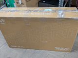 a box that is sitting on the floor in front of a pile of boxes