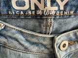 a close up of a pair of jeans with a label on it