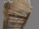 a wooden bed with a headboard made of wood
