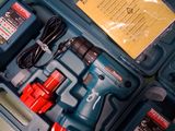 a blue box with tools inside of it on a table