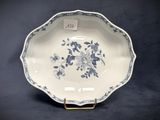 an image of a blue and white plate with flowers on it