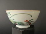 bowl on a black pedestal against a gray background
