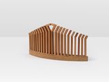 a wooden comb on a white surface with a white background