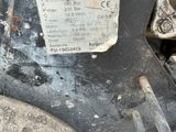a close up of the front wheel of a tractor