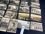 a lot of old black and white photos on the table