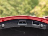 a close up of a steering wheel with two buttons on it