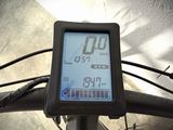 a close up of a bike with a clock on the front of it