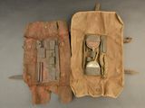 two old tools in a bag on a table