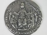 an image of a silver coin with a picture of a man and a woman